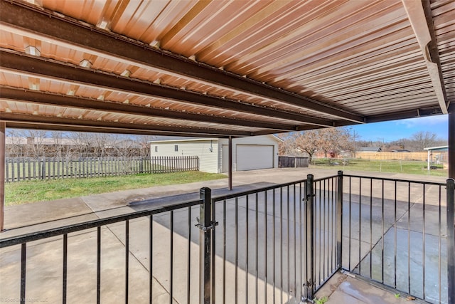 view of patio / terrace featuring a garage and an outdoor structure