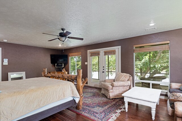 bedroom with hardwood / wood-style flooring, access to outside, french doors, and ceiling fan