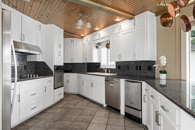 kitchen featuring white cabinetry, appliances with stainless steel finishes, sink, and backsplash