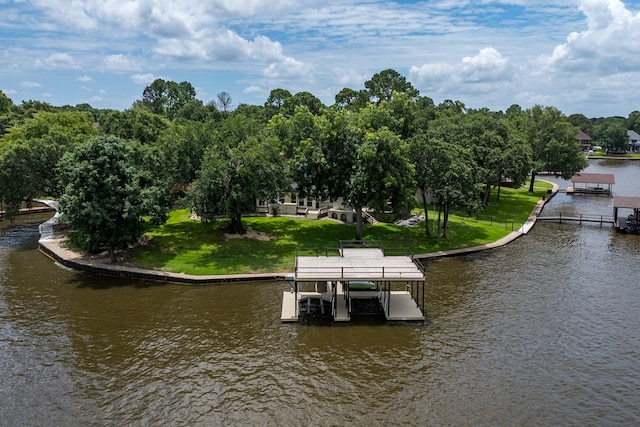 dock area featuring a water view and a yard