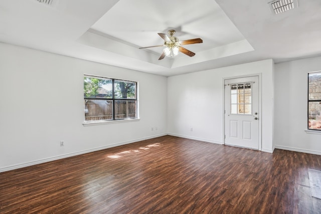 128 Black Forest Dr, Weatherford, TX 76086 - spare room featuring visible vents, wood finished floors, a ceiling fan, and a raised ceiling