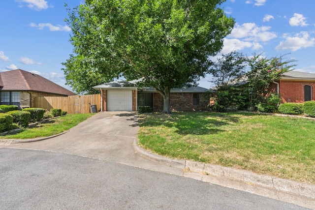 128 Black Forest Dr, Weatherford, TX 76086 - ranch-style house with fence, an attached garage, a front yard, brick siding, and driveway