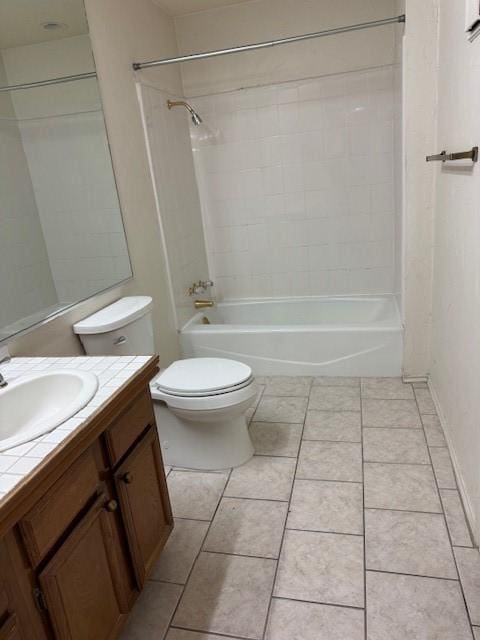 full bathroom with vanity, toilet, tiled shower / bath combo, and tile patterned flooring