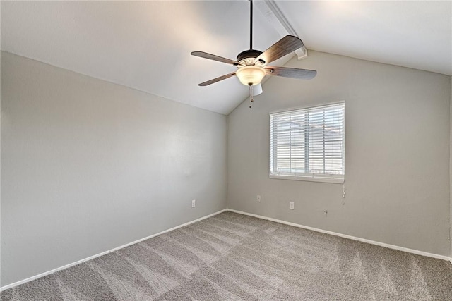 unfurnished room with ceiling fan, vaulted ceiling, and carpet