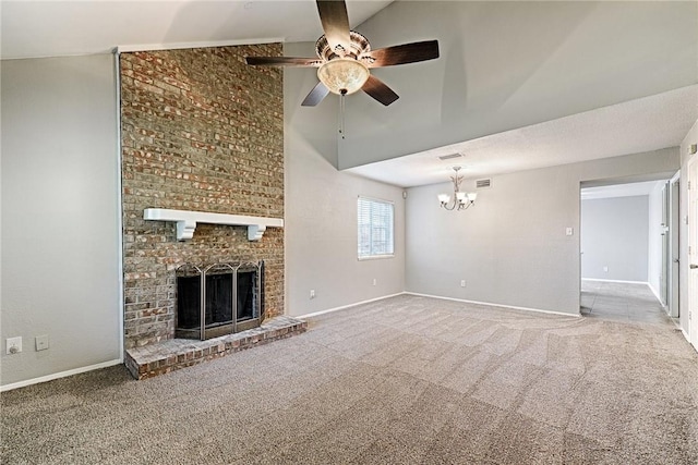 unfurnished living room with lofted ceiling, carpet flooring, ceiling fan with notable chandelier, and a fireplace