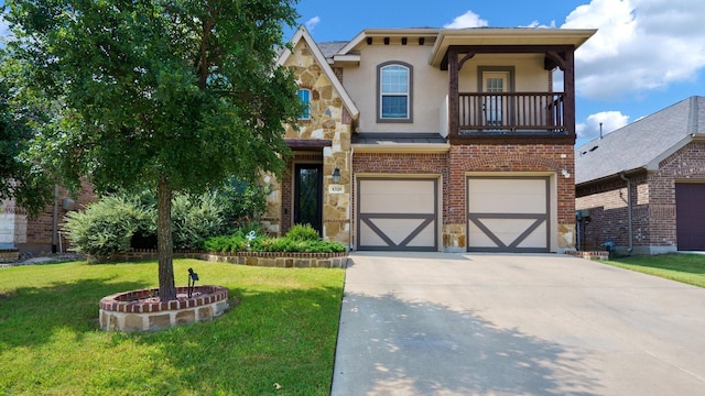 view of front of home with a garage, a balcony, and a front yard