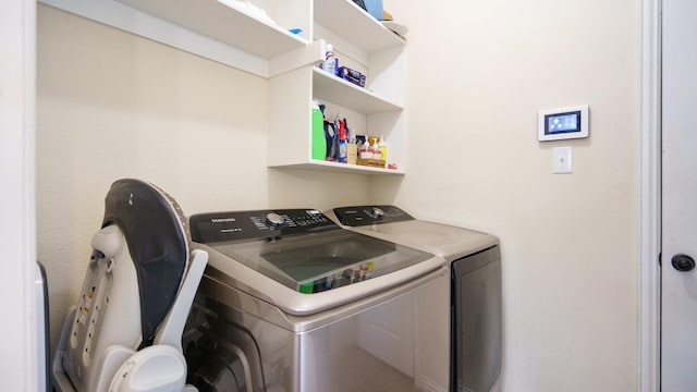 laundry area with washing machine and clothes dryer