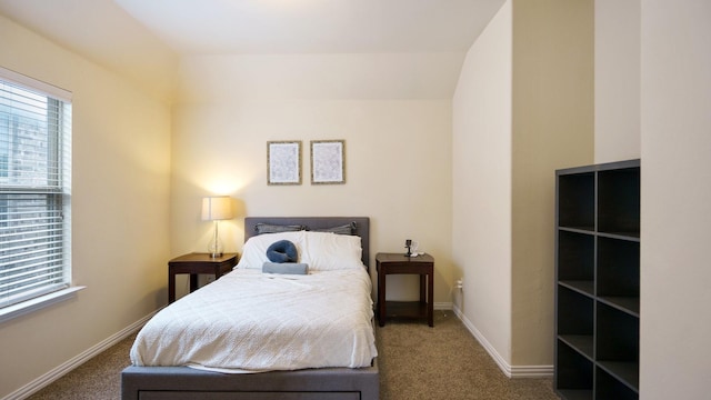 bedroom featuring dark colored carpet