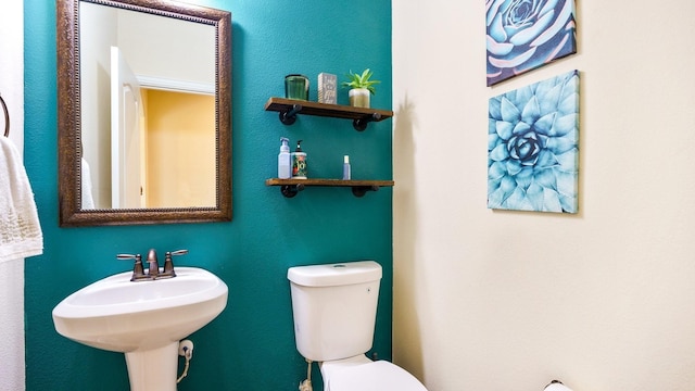 bathroom featuring sink and toilet