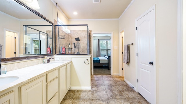 bathroom with ornamental molding, an enclosed shower, and vanity