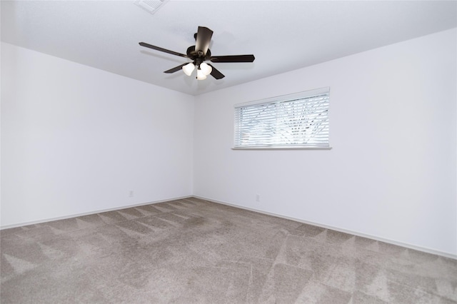 spare room with light carpet and ceiling fan