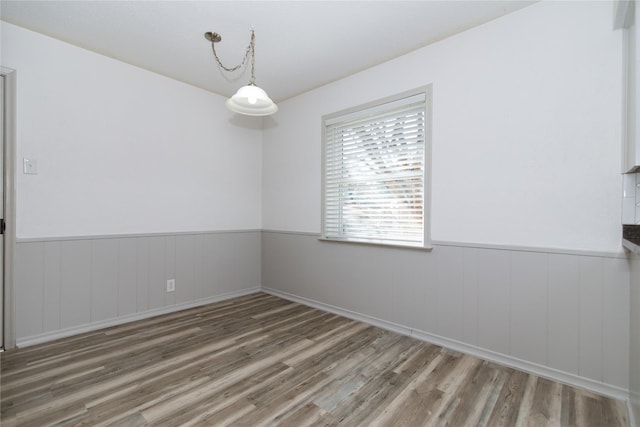 spare room with hardwood / wood-style floors