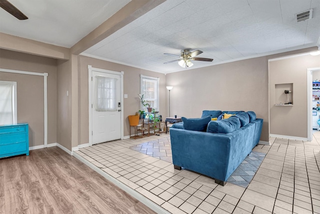 living room featuring crown molding, ceiling fan, and light hardwood / wood-style flooring