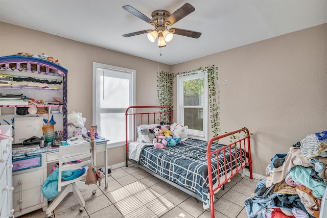 bedroom with light tile patterned floors and ceiling fan