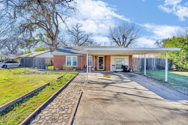 single story home featuring a carport and a front lawn