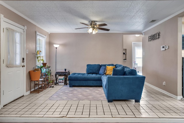 tiled living room with ornamental molding and ceiling fan