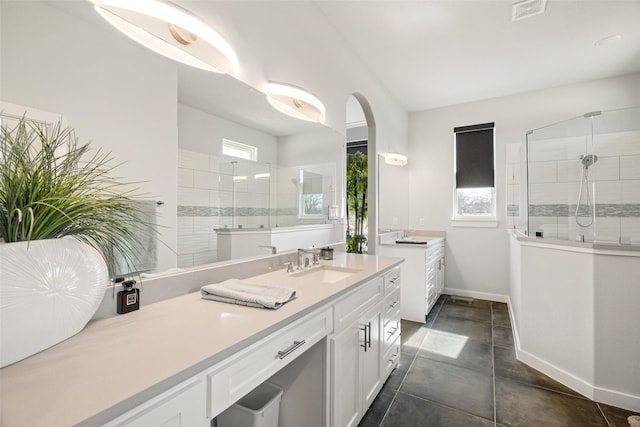 bathroom with vanity and an enclosed shower