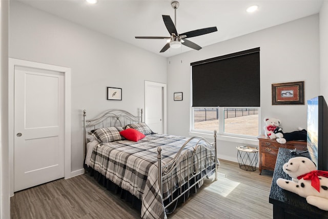 bedroom featuring wood-type flooring and ceiling fan