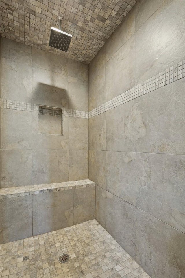 bathroom with tiled shower