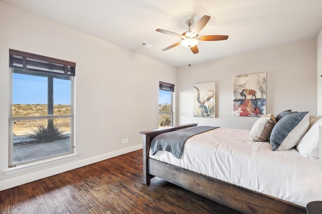 bedroom with dark wood-type flooring and ceiling fan