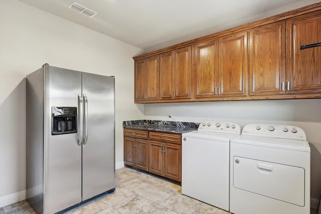 laundry room featuring washer and clothes dryer