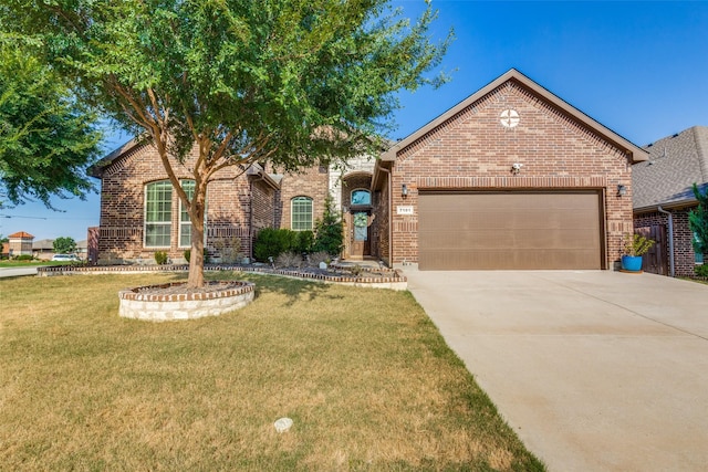 view of front of house with a garage and a front lawn