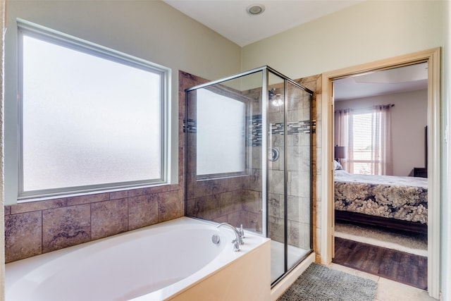 bathroom featuring plus walk in shower