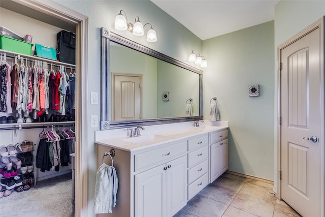 bathroom with vanity and tile patterned flooring