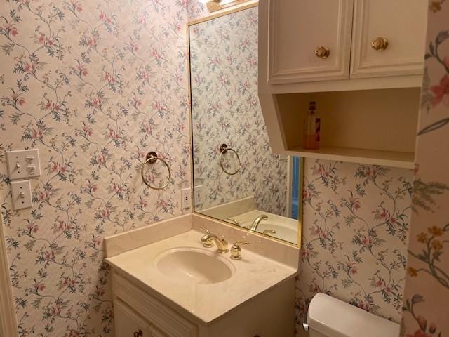 bathroom with vanity and toilet