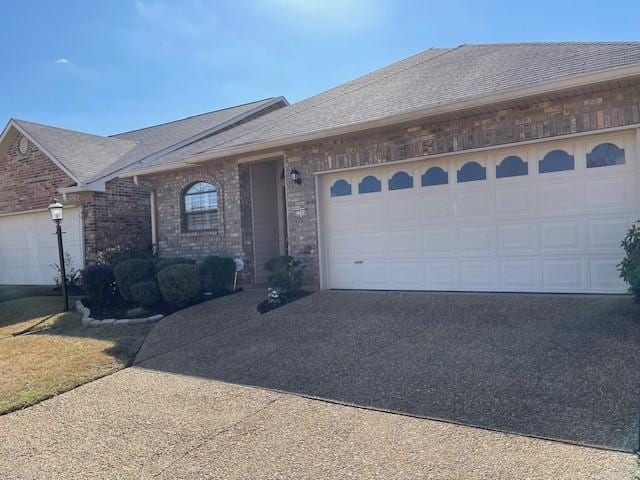 single story home with a garage