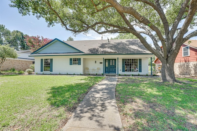 ranch-style home with a front lawn