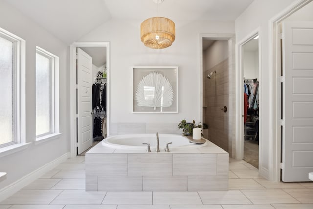 bathroom with vaulted ceiling and plus walk in shower