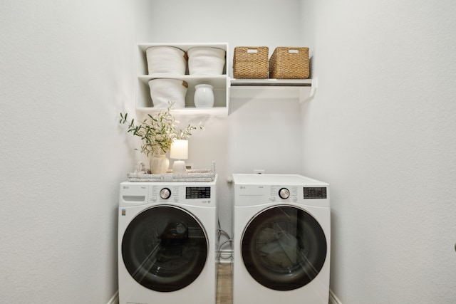 laundry room with washing machine and clothes dryer