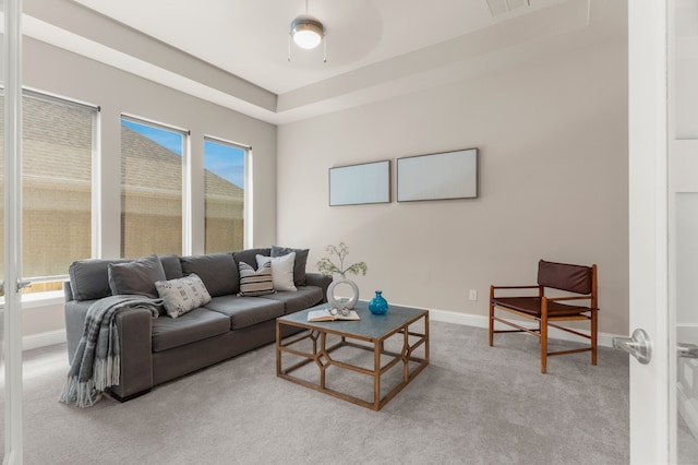 living room with ceiling fan and light carpet