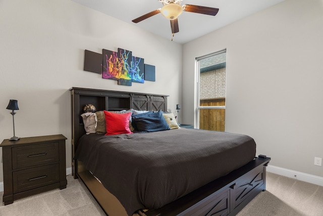 bedroom with light colored carpet and ceiling fan