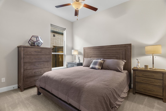 bedroom with ceiling fan and light colored carpet