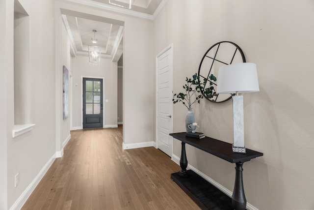 entrance foyer featuring hardwood / wood-style floors and ornamental molding