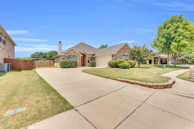 single story home featuring a garage, a front yard, and central air condition unit