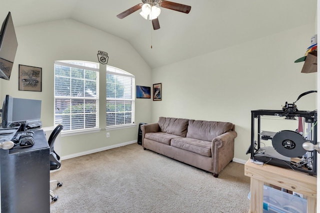 office area with lofted ceiling, light carpet, and ceiling fan