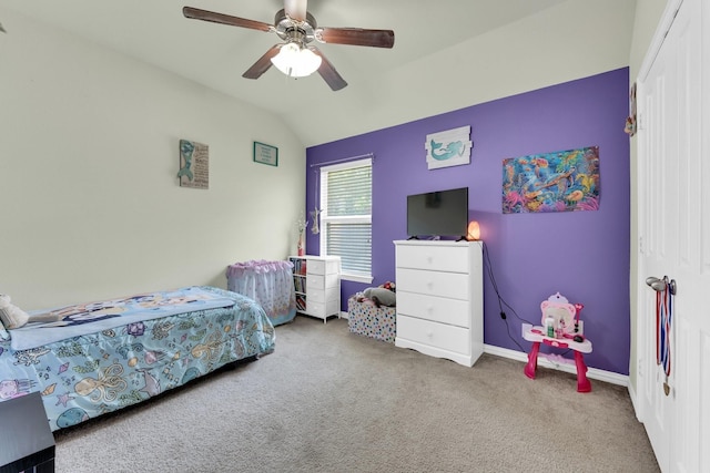 bedroom featuring ceiling fan, vaulted ceiling, and carpet