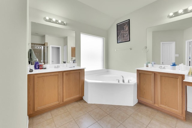 bathroom with tile patterned flooring, plus walk in shower, vaulted ceiling, and vanity