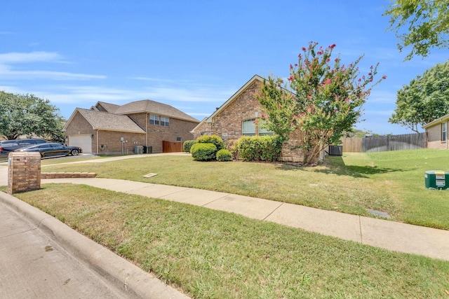 view of front of property featuring a garage and a front yard