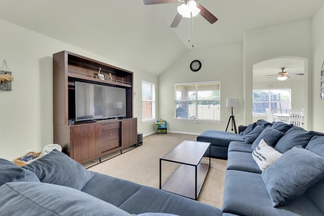 carpeted living room featuring ceiling fan and lofted ceiling