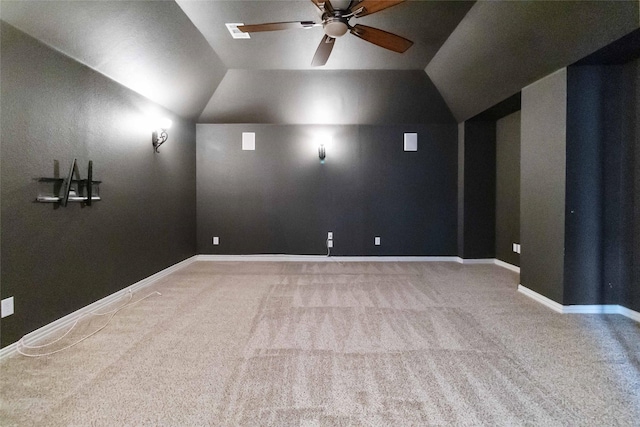 interior space featuring vaulted ceiling, ceiling fan, and carpet