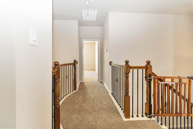 hallway featuring carpet flooring