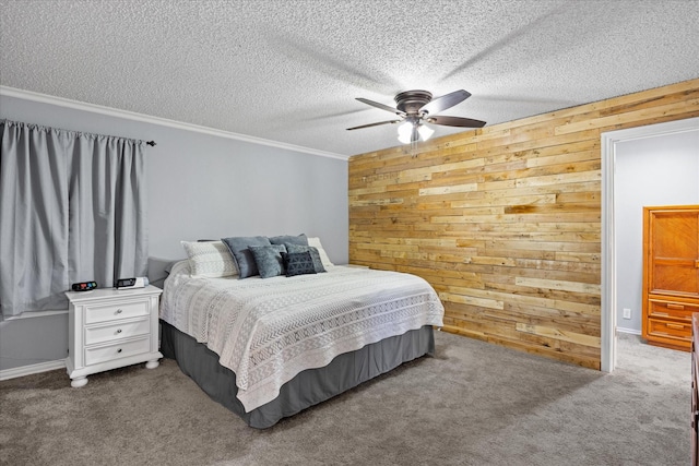 carpeted bedroom featuring ceiling fan, crown molding, wooden walls, and a textured ceiling