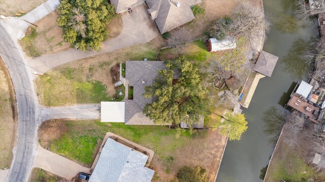 dock area featuring a water view and a yard