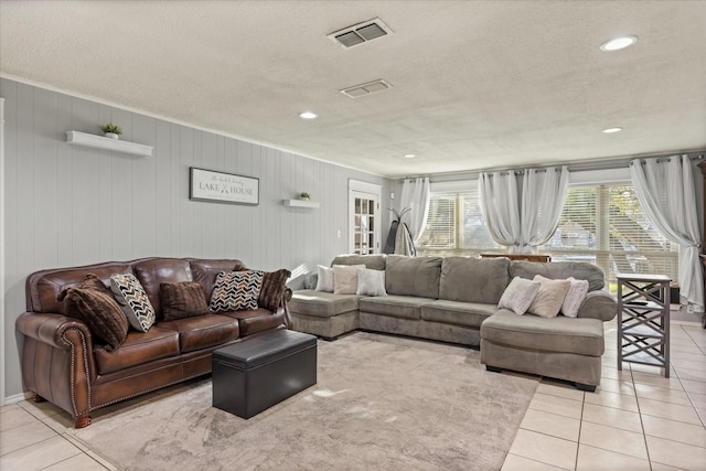 tiled living room with a textured ceiling