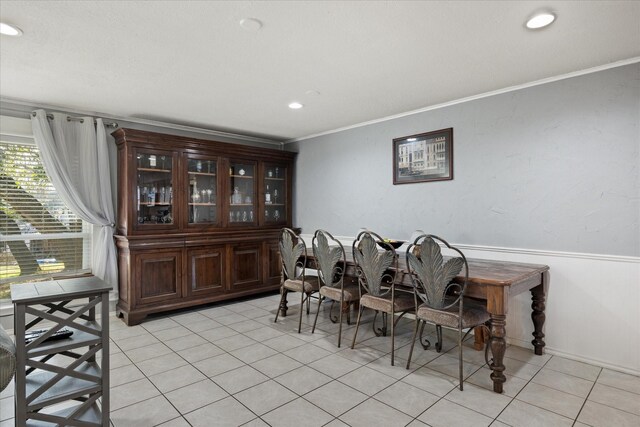 living room featuring a fireplace, tile patterned flooring, a barn door, a textured ceiling, and built in shelves