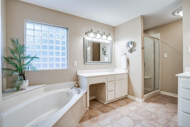 bathroom featuring vanity, plus walk in shower, and tile patterned flooring